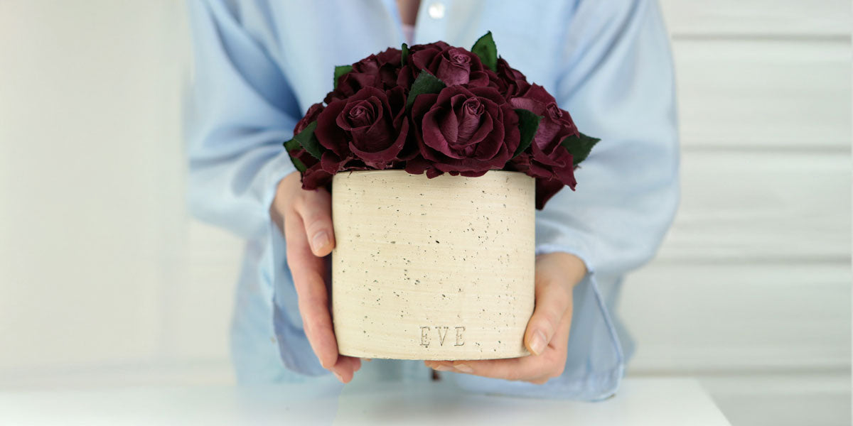 Elevate Your Space with Evergreen Roses' Timeless Floral Arrangements in Concrete Vases