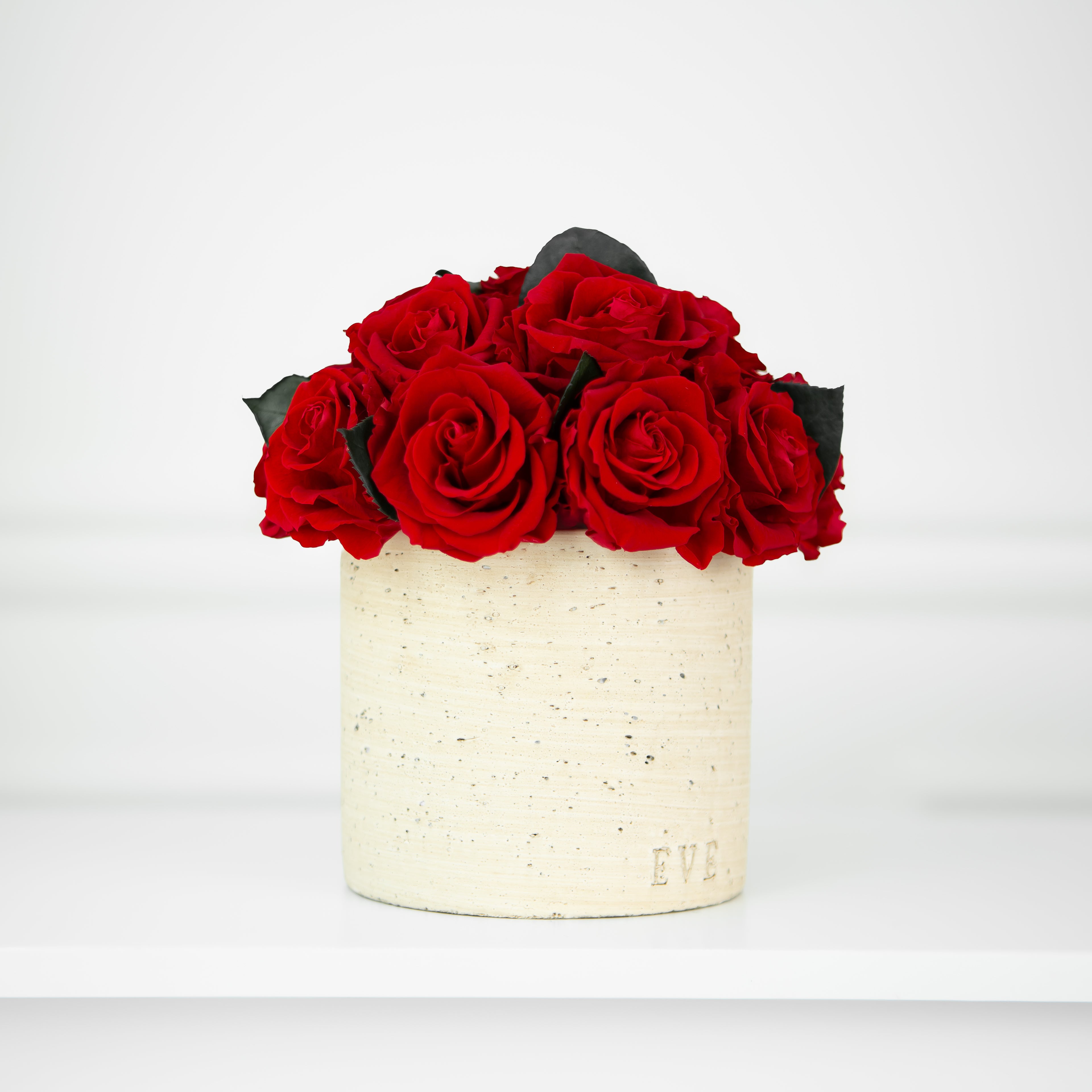 Beige Concrete Vase with Red Roses